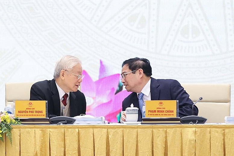 Tổng Bí thư Nguyễn Phú Trọng trao đổi với Thủ tướng Phạm Minh Chính tại Hội nghị Chính phủ với địa phương vào tháng 1/2022 - Ảnh VGP/Nhật Bắc